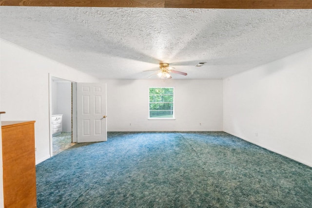 unfurnished room featuring visible vents, a ceiling fan, carpet floors, and a textured ceiling