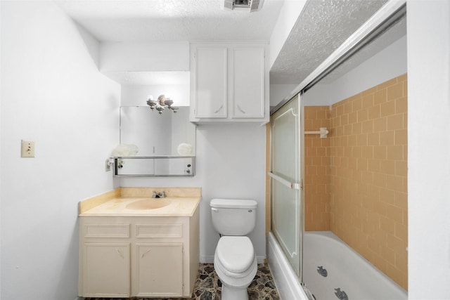 full bath featuring a textured ceiling, combined bath / shower with glass door, visible vents, toilet, and vanity