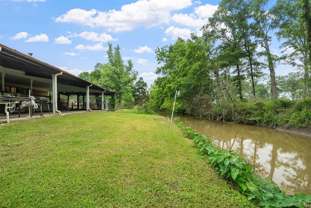 view of yard with a water view