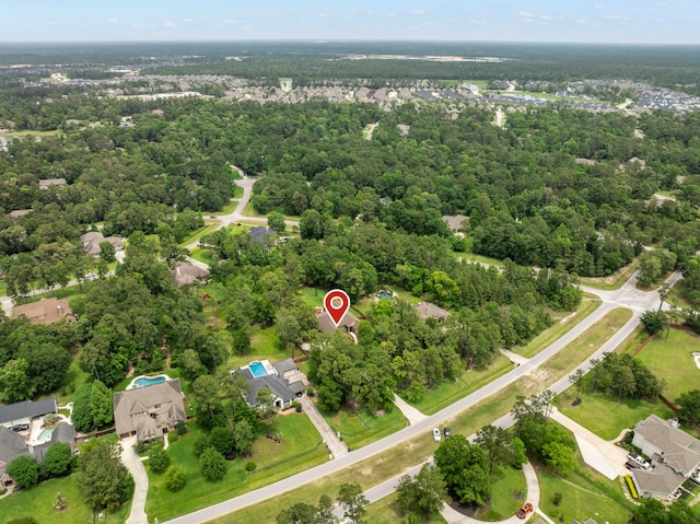 aerial view featuring a wooded view