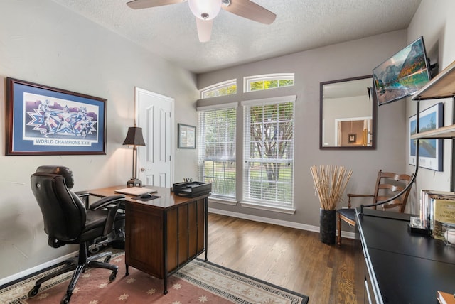 office area featuring baseboards, a ceiling fan, a textured ceiling, and wood finished floors