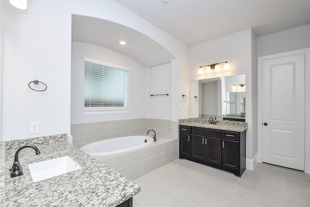 6939 Shoreline View Dr, Katy, TX 77493 - full bath with a sink, tile patterned flooring, a garden tub, and two vanities