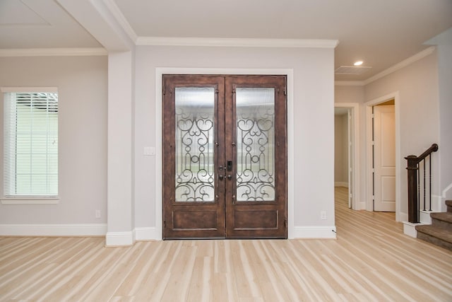 6939 Shoreline View Dr, Katy, TX 77493 - entrance foyer featuring french doors, ornamental molding, and wood finished floors