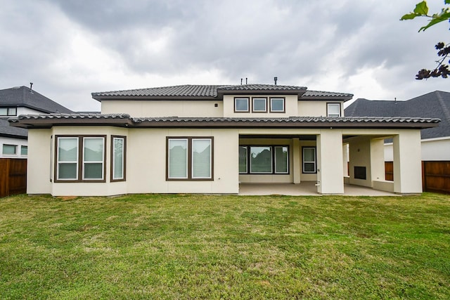 6939 Shoreline View Dr, Katy, TX 77493 - back of property featuring fence, stucco siding, a lawn, and a patio area