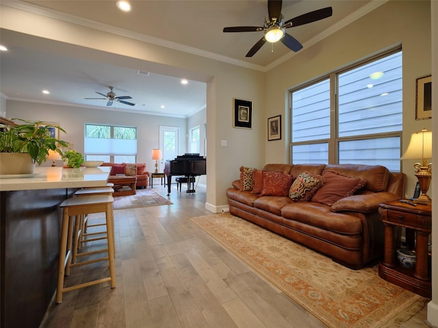 living room with recessed lighting, a ceiling fan, light wood-style flooring, and baseboards