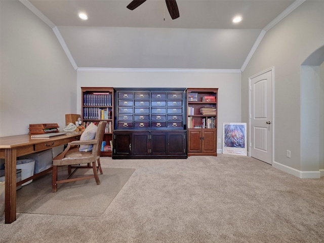 office space with light colored carpet, ceiling fan, vaulted ceiling, and ornamental molding