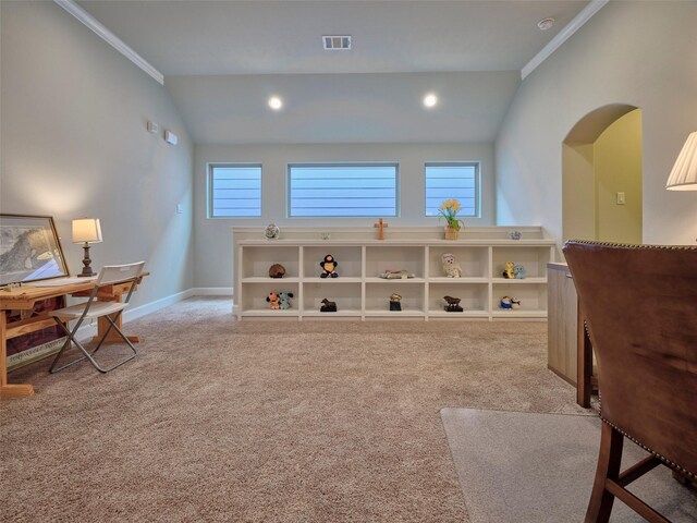 sitting room with crown molding, baseboards, vaulted ceiling, and light carpet