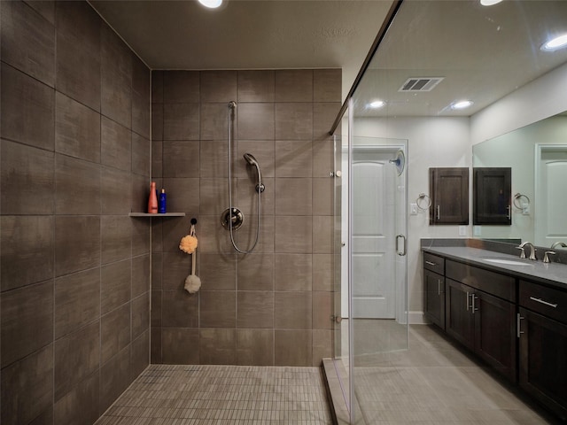 full bath with visible vents, a shower stall, vanity, tile patterned floors, and recessed lighting