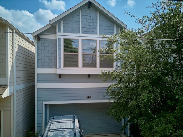 view of property exterior featuring a garage