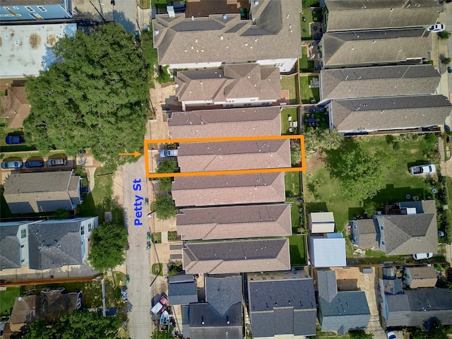 birds eye view of property with a residential view