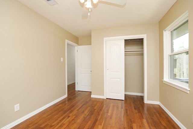 5714 Nina Lee Ln, Houston, TX 77092 - unfurnished bedroom with wood finished floors, a closet, baseboards, and ceiling fan