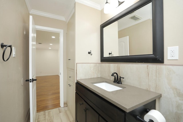 5714 Nina Lee Ln, Houston, TX 77092 - bathroom featuring ornamental molding, vanity, and wood finished floors