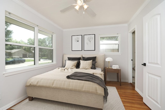 5714 Nina Lee Ln, Houston, TX 77092 - bedroom featuring baseboards, wood finished floors, ornamental molding, and a ceiling fan