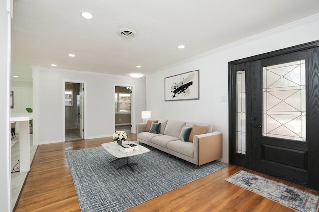 5714 Nina Lee Ln, Houston, TX 77092 - living area featuring ornamental molding, wood finished floors, recessed lighting, and baseboards