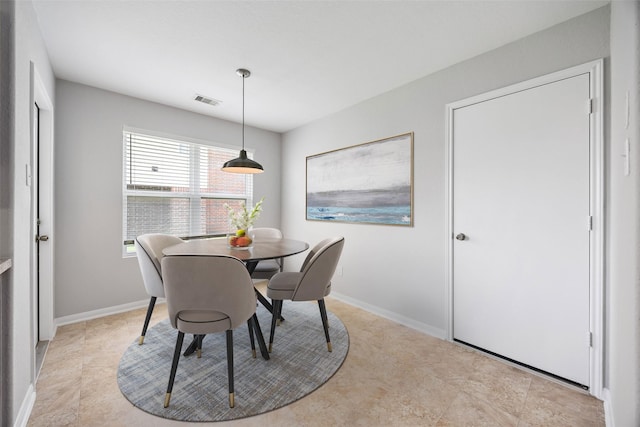 dining room with visible vents and baseboards