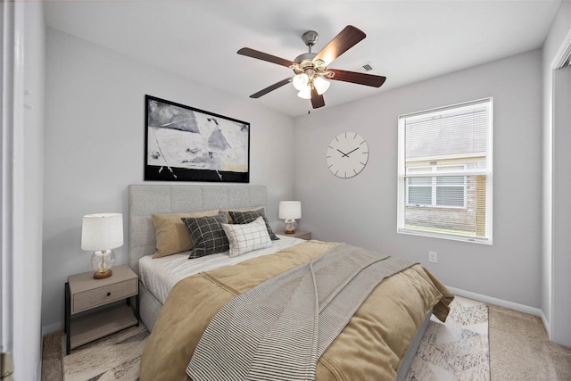 bedroom featuring carpet, visible vents, a ceiling fan, and baseboards