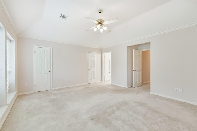 unfurnished room with vaulted ceiling, light carpet, a ceiling fan, and visible vents