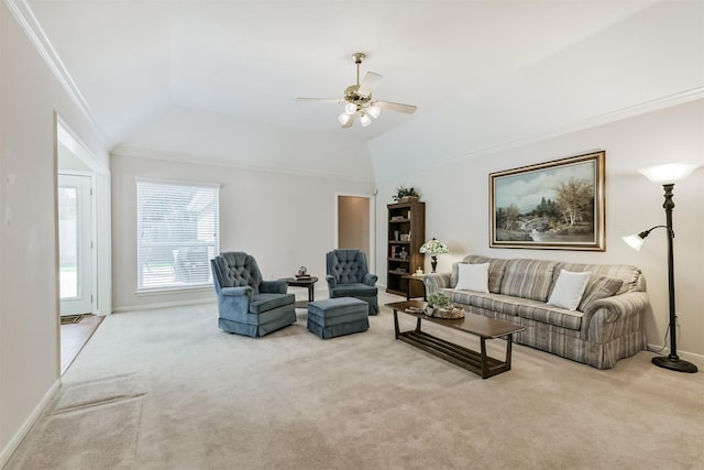 carpeted living room featuring ceiling fan, ornamental molding, baseboards, and lofted ceiling
