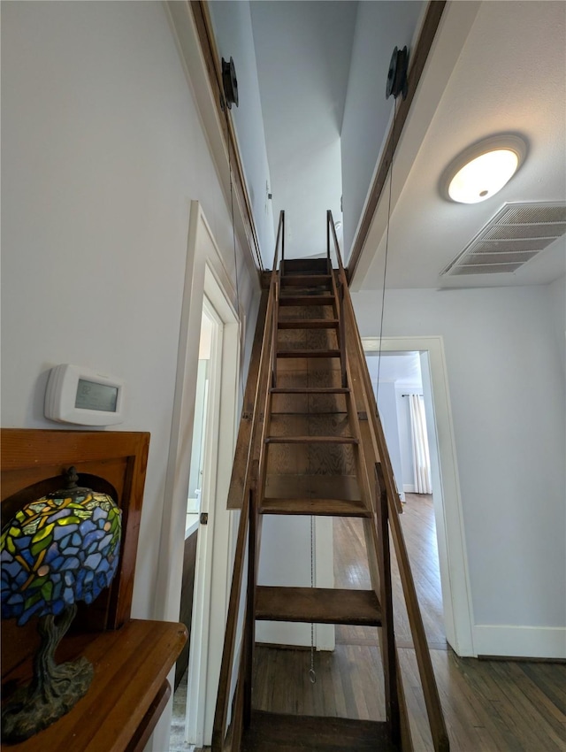 4701 Woodrow Ave, Galveston, TX 77551 - stairs with wood finished floors
