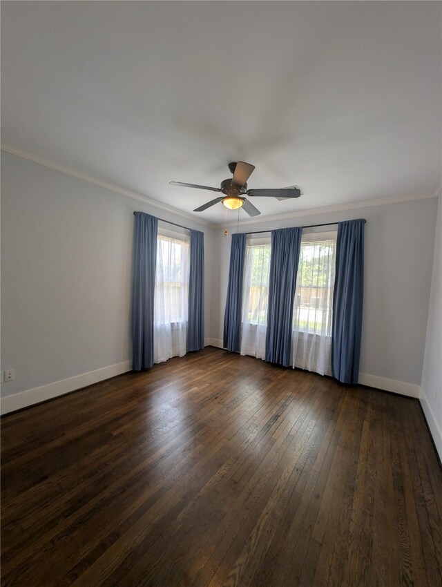 4701 Woodrow Ave, Galveston, TX 77551 - empty room featuring a ceiling fan, dark wood-type flooring, ornamental molding, and baseboards