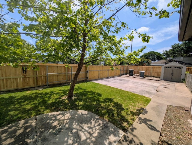 view of yard featuring a storage shed, a patio, an outbuilding, and a fenced backyard
