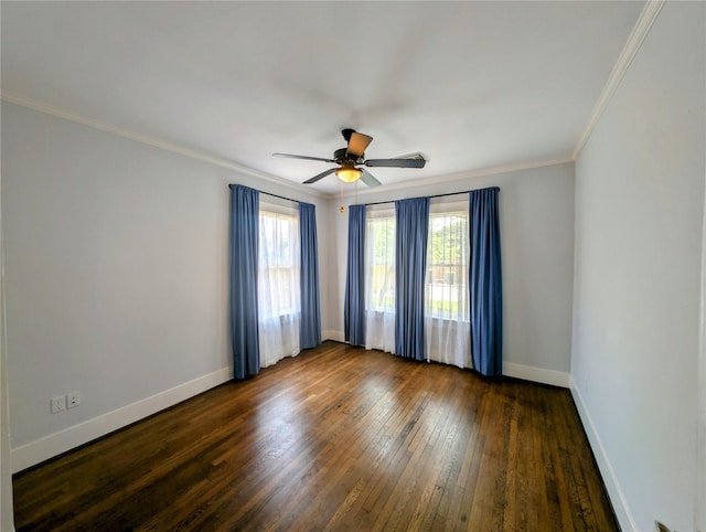 unfurnished room with crown molding, dark wood-style flooring, ceiling fan, and baseboards