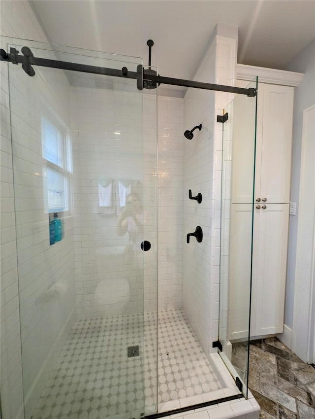 full bath with a shower stall