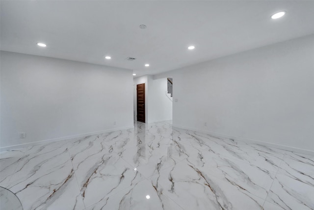 spare room featuring recessed lighting and visible vents