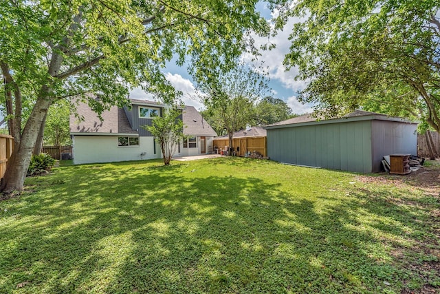 view of yard with a fenced backyard and a patio area
