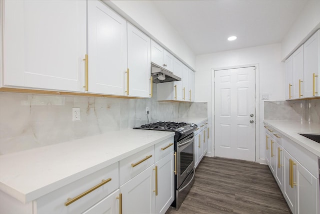 kitchen featuring recessed lighting, decorative backsplash, stainless steel gas range oven, under cabinet range hood, and white cabinetry