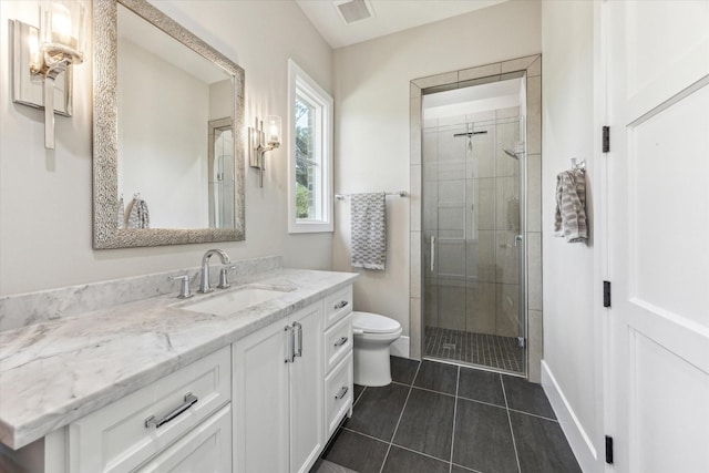13927 Perthshire Rd, Houston, TX 77079 - bathroom featuring vanity, a stall shower, toilet, tile patterned floors, and baseboards
