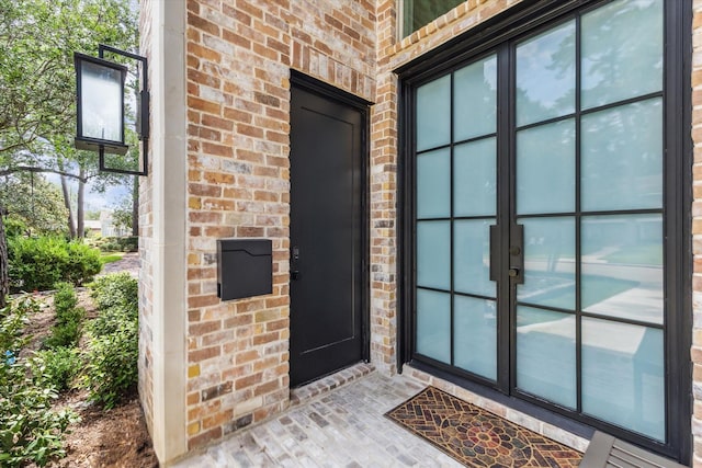 13927 Perthshire Rd, Houston, TX 77079 - property entrance with brick siding and french doors