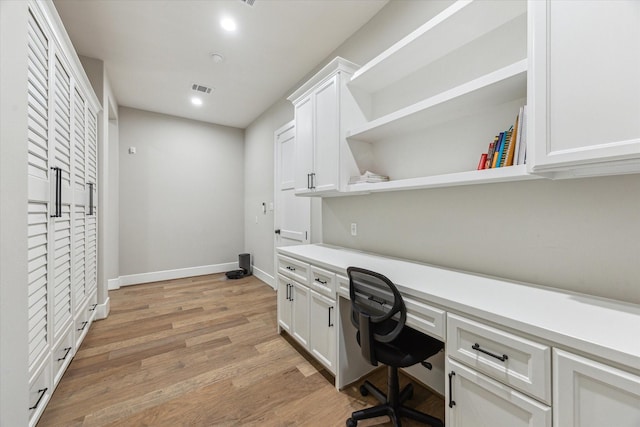 13927 Perthshire Rd, Houston, TX 77079 - office space featuring built in desk, light wood finished floors, recessed lighting, and baseboards