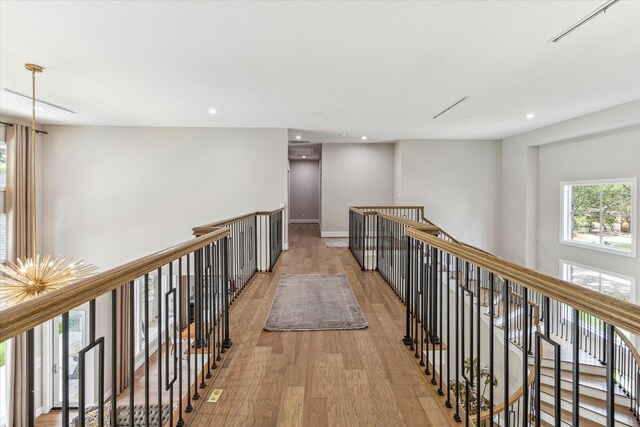 13927 Perthshire Rd, Houston, TX 77079 - corridor featuring an upstairs landing, light wood-style flooring, recessed lighting, and baseboards