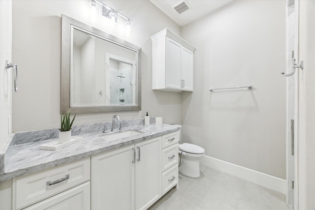 13927 Perthshire Rd, Houston, TX 77079 - bathroom with vanity, toilet, baseboards, and tile patterned floors