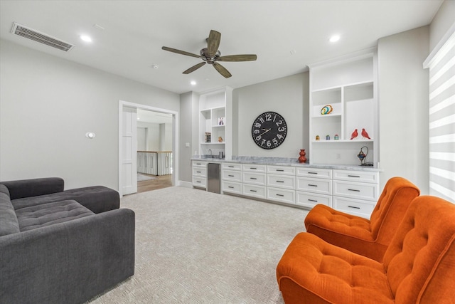 13927 Perthshire Rd, Houston, TX 77079 - living area with ceiling fan, built in features, carpet flooring, recessed lighting, and baseboards