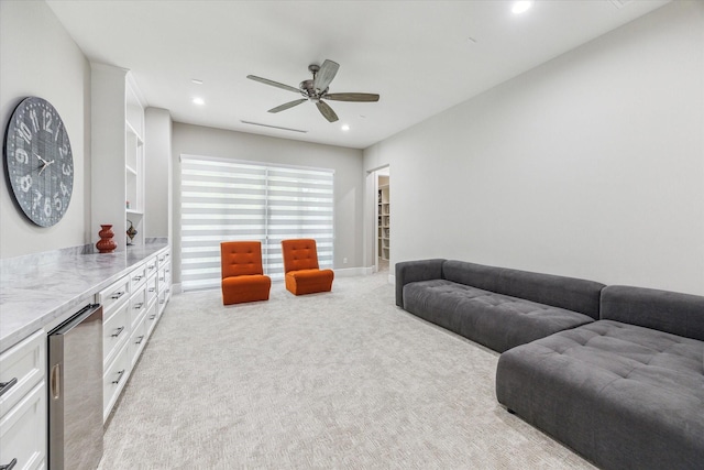 13927 Perthshire Rd, Houston, TX 77079 - living room with light colored carpet, wine cooler, ceiling fan, and recessed lighting