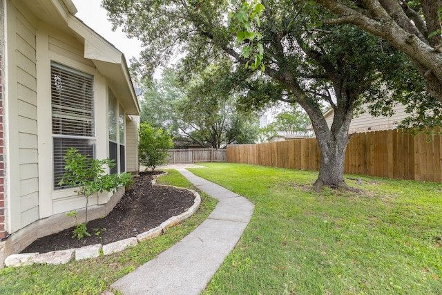 view of yard with a fenced backyard