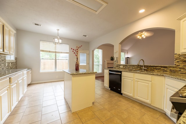 kitchen featuring visible vents, black dishwasher, recessed lighting, a sink, and backsplash