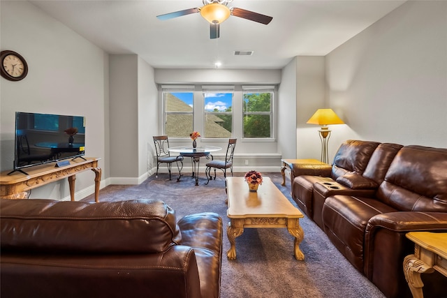 carpeted living room with visible vents, ceiling fan, and baseboards