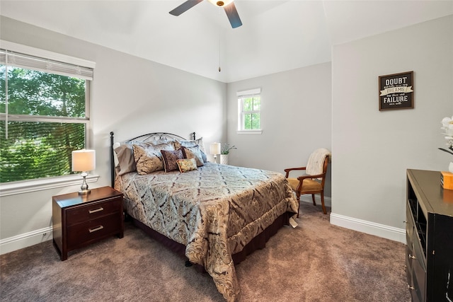 bedroom featuring dark colored carpet, a ceiling fan, vaulted ceiling, and baseboards