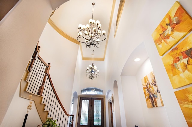 6310 Indiangrass Ct, Katy, TX 77494 - entrance foyer featuring a chandelier, a high ceiling, and arched walkways
