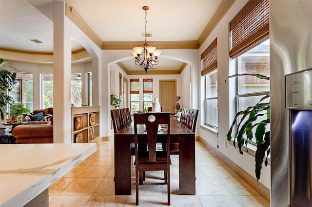 6310 Indiangrass Ct, Katy, TX 77494 - dining area with arched walkways, ornamental molding, light tile patterned flooring, and plenty of natural light