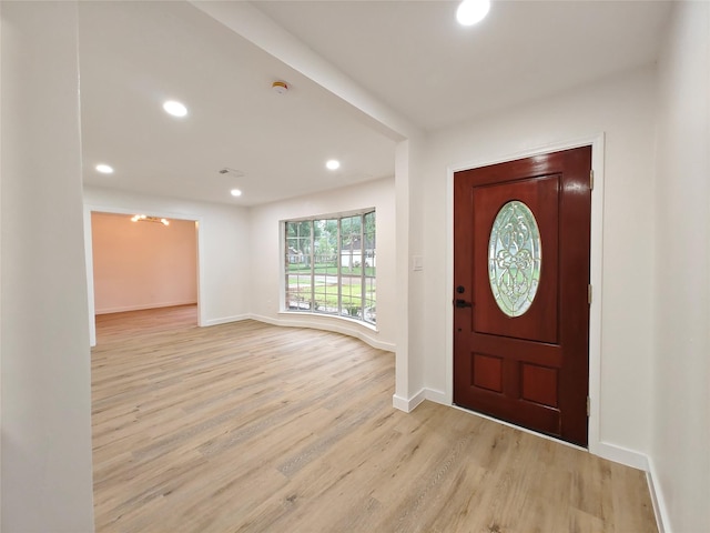 entrance foyer featuring light wood finished floors, recessed lighting, and baseboards