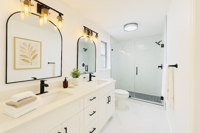 bathroom with toilet, a shower stall, and a sink