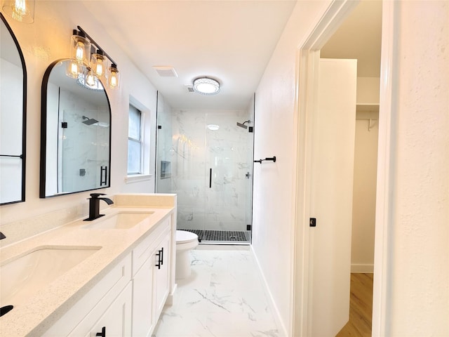 bathroom with toilet, a marble finish shower, marble finish floor, and a sink