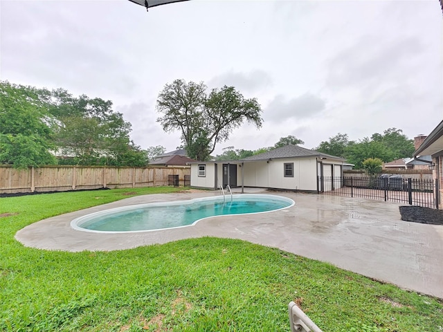 view of pool with a fenced backyard, a yard, a patio area, and a fenced in pool