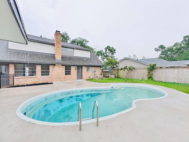 view of pool featuring a fenced in pool, a fenced backyard, and a patio area