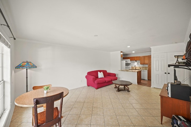 living area featuring recessed lighting, ornamental molding, and light tile patterned floors