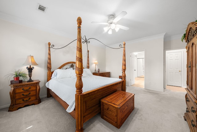 bedroom with a ceiling fan, visible vents, baseboards, ornamental molding, and light carpet